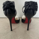 Black leather peep-toe platform pumps with bow detail and lace-up ankle straps — Christian Louboutin | Endless UAE
