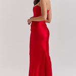 Elegant red strapless corset maxi dress with fitted bodice and flowing skirt, shown from side angle — House of CB | Endless UAE