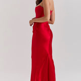 Elegant red strapless corset maxi dress with fitted bodice and flowing skirt, shown from side angle — House of CB | Endless UAE