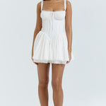 White corset mini dress with ruched bodice, tie front detail, smocked waist and flared skirt — House of CB | Endless UAE