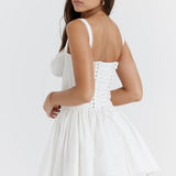 White corset mini dress with lace-up back, puff sleeves, and lace trim hem — House of CB | Endless UAE