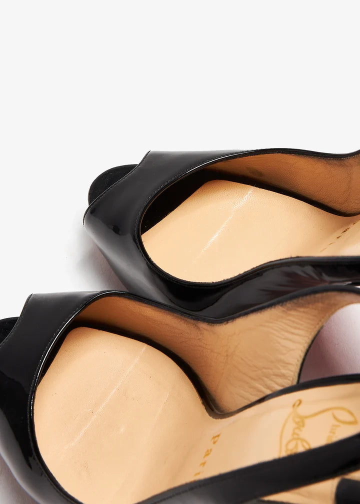 Black patent leather peep toe platform slingback heels with red sole — Christian Louboutin | Endless UAE