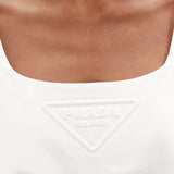White cotton-drill mini dress with embossed triangular logo detail at chest — Prada | Endless UAE