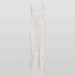Woman wearing white Primrose Dress against weathered stone wall — Rat & Boa | Endless UAE