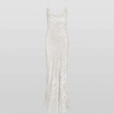 Woman wearing white Primrose Dress against weathered stone wall — Rat & Boa | Endless UAE