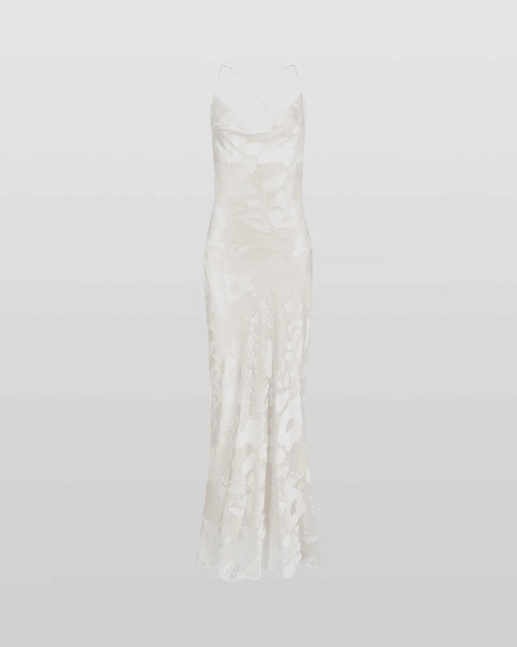 Woman wearing white Primrose Dress against weathered stone wall — Rat & Boa | Endless UAE