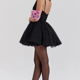 Woman wearing black tulle mini dress with sweetheart neckline and full skirt — House of CB | Endless UAE
