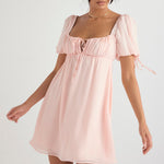 Light pink babydoll mini dress with puff sleeves, square neckline and tie front detail — House of CB | Endless UAE