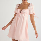 Light pink babydoll mini dress with puff sleeves, square neckline and tie front detail — House of CB | Endless UAE