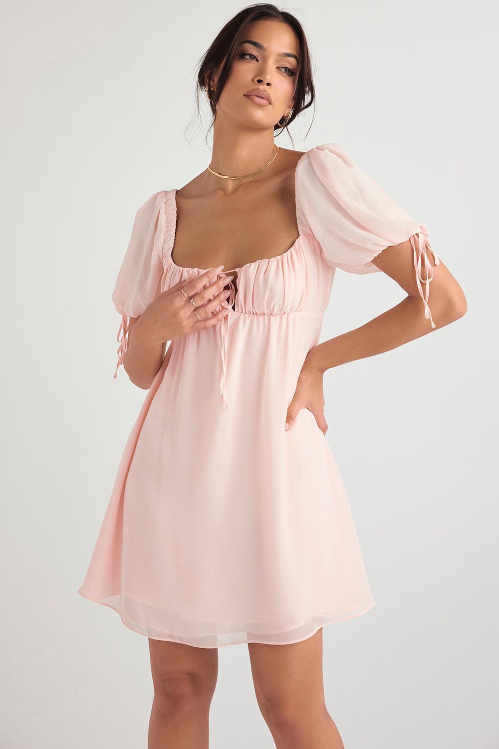 Soft pink mini dress with puff sleeves, square neckline with lace-up detail and gathered empire waist — House of CB | Endless UAE