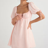Soft pink mini dress with puff sleeves, square neckline with lace-up detail and gathered empire waist — House of CB | Endless UAE