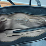 Black leather tote bag with dual handles and Coach branding — Coach | Endless UAE