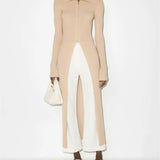 Beige ribbed knit midi dress with front zip closure and long sleeves worn with white pants and slides — Nanushka | Endless UAE