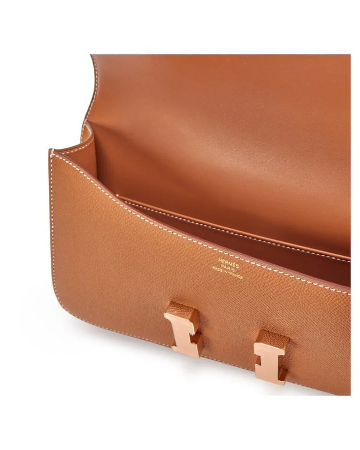Tan leather Hermès Constance Elan clutch with white contrast stitching and rose gold hardware, shown open — Hermes | Endless UAE