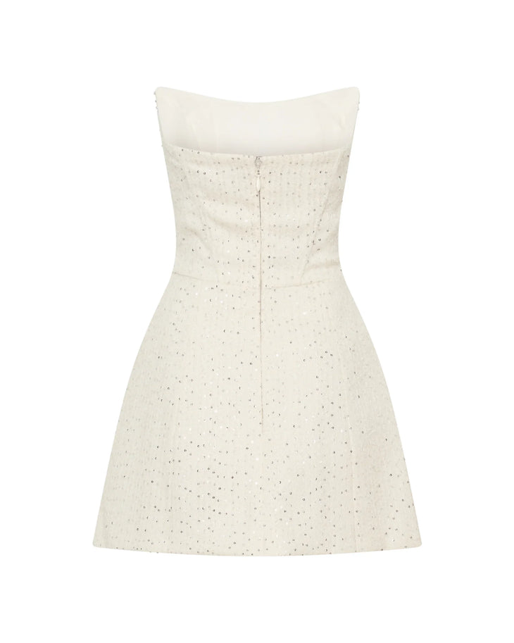 Woman wearing white strapless tweed corset mini dress against black background — Meshki | Endless UAE