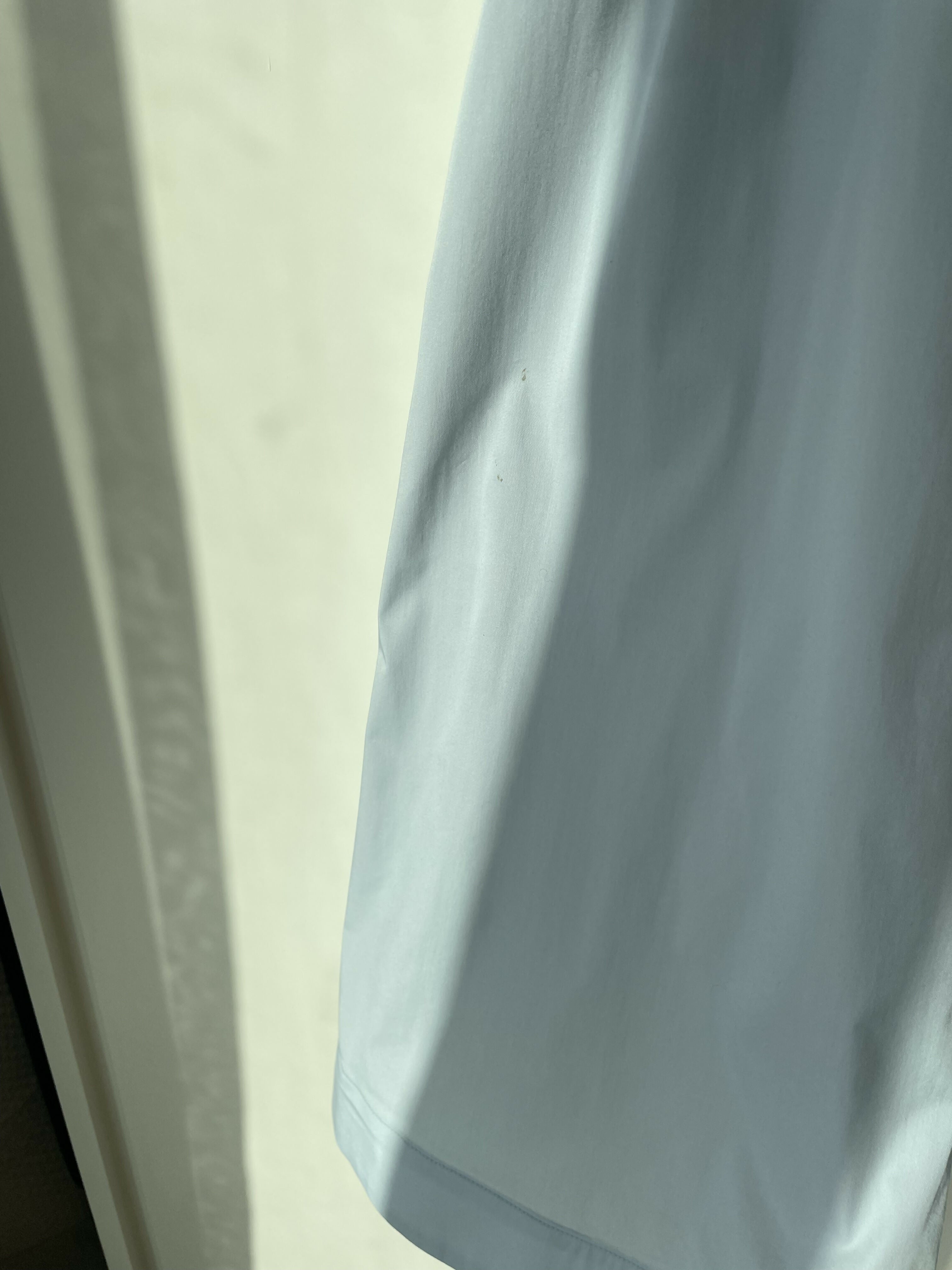 Woman wearing light blue sleeveless midi dress with corset top and full skirt — Endless | Endless UAE