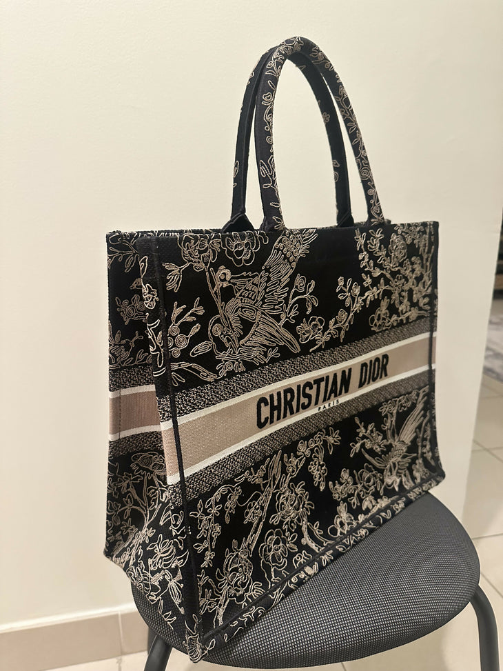 Black embroidered Book Tote with gold floral motif and beige Christian Dior logo band — Christian Dior | Endless UAE