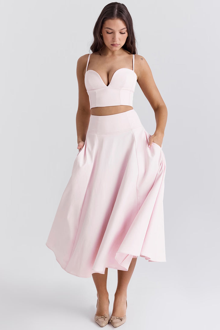 Pale pink two-piece co-ord set with structured corset crop top and flowing midi skirt with pockets — House of CB | Endless UAE