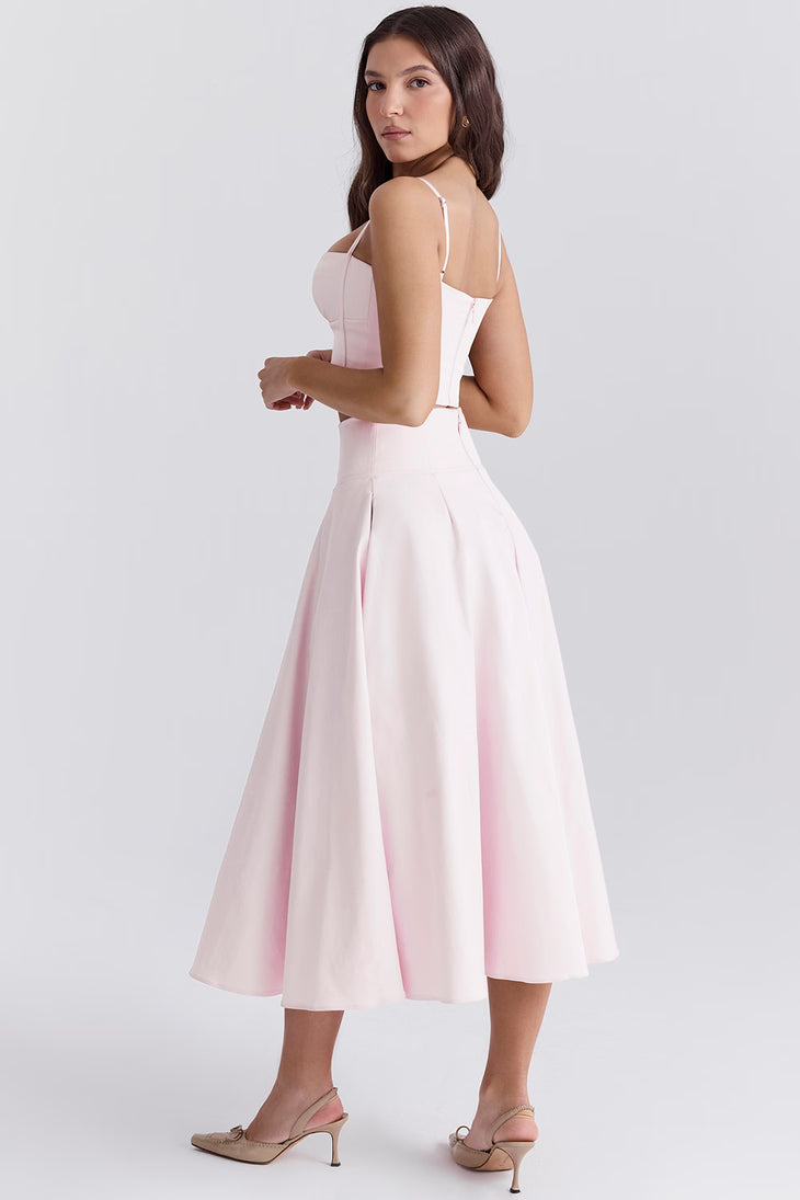 Elegant pale pink two-piece set with structured corset top and flowing midi skirt, perfect for formal occasions — House of CB | Endless UAE