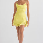 Bright yellow mini dress with cowl neckline, thin straps, fitted bodice and ruffled hem worn by model — House of CB | Endless UAE