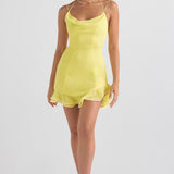 Bright yellow mini dress with cowl neckline, thin straps, fitted bodice and ruffled hem worn by model — House of CB | Endless UAE