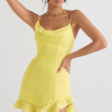 Model wearing buttercup yellow mini dress with cowl neckline, thin straps and layered ruffle hem — House of CB | Endless UAE