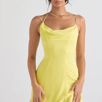 Bright yellow mini dress with cowl neckline, double straps, and tiered ruffle hem modeled on woman — House of CB | Endless UAE