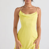 Bright yellow mini dress with cowl neckline, double straps, and tiered ruffle hem modeled on woman — House of CB | Endless UAE