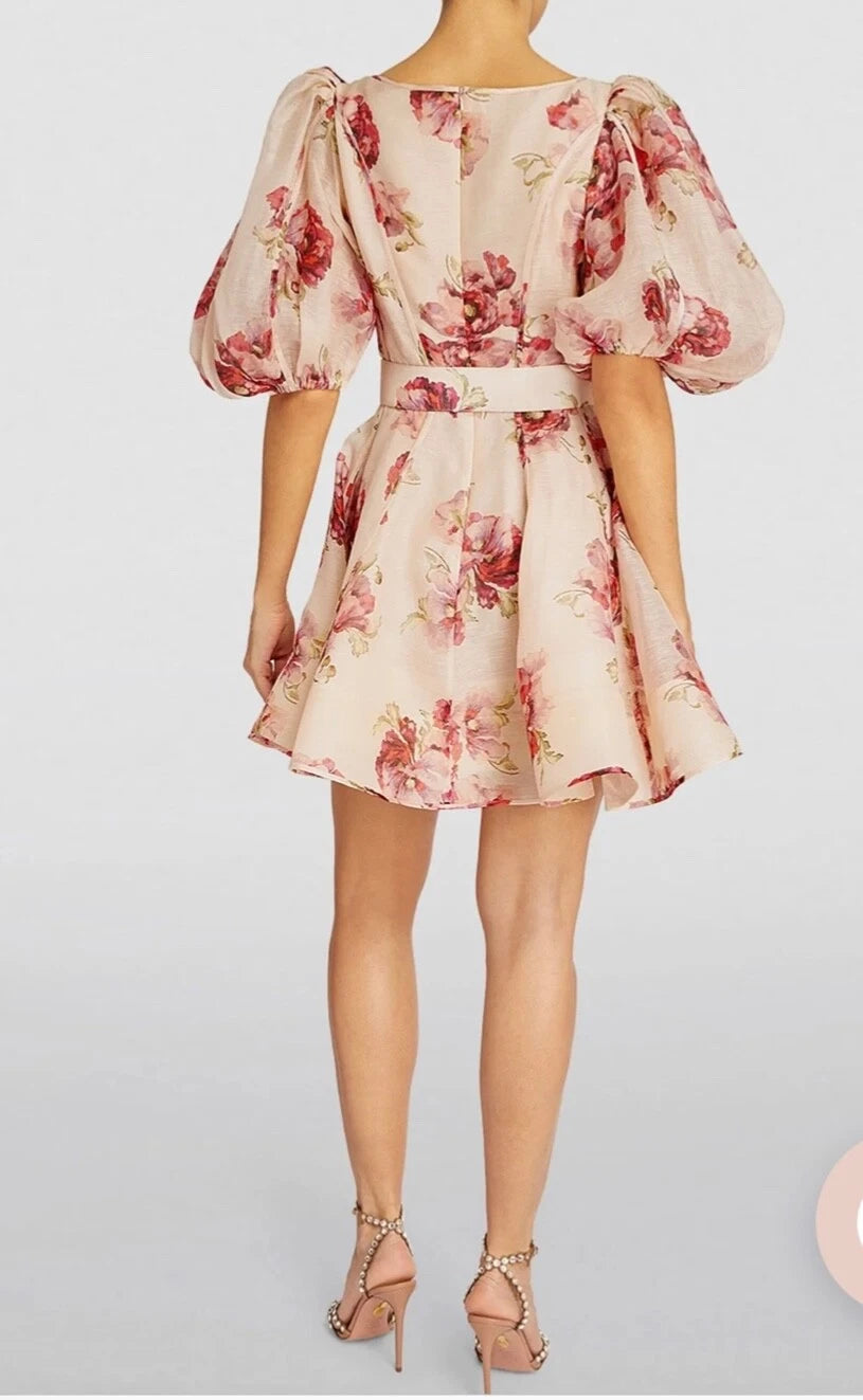 Zimmermann floral print mini dress with puff sleeves and belt, back view on model with heels — ZIMMERMANN | Endless UAE