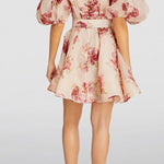 Zimmermann floral print mini dress with puff sleeves and belt, back view on model with heels — ZIMMERMANN | Endless UAE