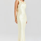 Model wearing pale yellow satin cowl neck maxi dress with elegant draping and sleek silhouette — House of CB | Endless UAE