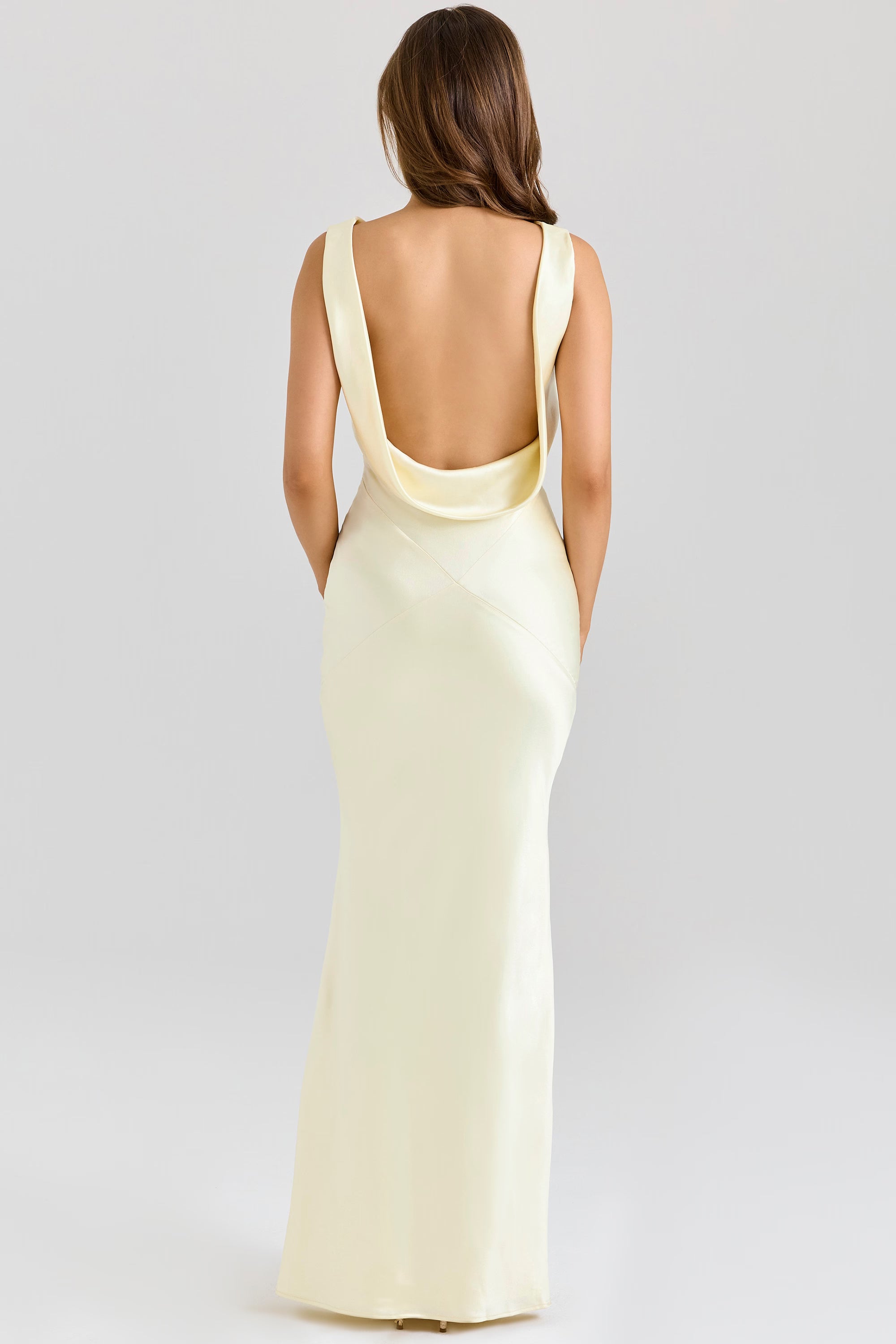 Elegant pale yellow satin maxi dress with dramatic open back and cowl neck draping detail — House of CB | Endless UAE