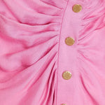 Pink wrap mini dress with button detail and long sleeves — Sandro | Endless UAE