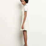 White knitted polo dress with black striped collar and trim details — Sandro | Endless UAE