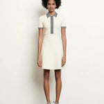 White knitted polo dress with black striped collar and trim details — Sandro | Endless UAE