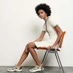 White knitted polo dress with black striped collar and trim details — Sandro | Endless UAE