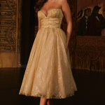 Woman wearing gold metallic lace tulle strapless midi gown with ruched waist — House of CB | Endless UAE