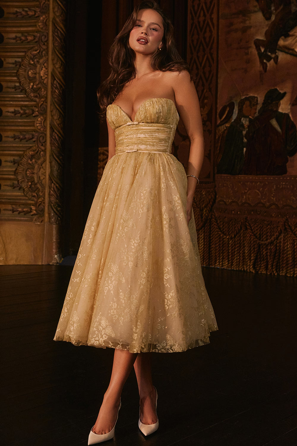 Woman wearing gold metallic lace tulle strapless midi gown with ruched waist — House of CB | Endless UAE