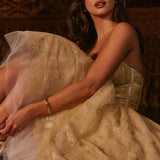 Woman wearing gold metallic lace tulle strapless midi gown with ruched waist — House of CB | Endless UAE