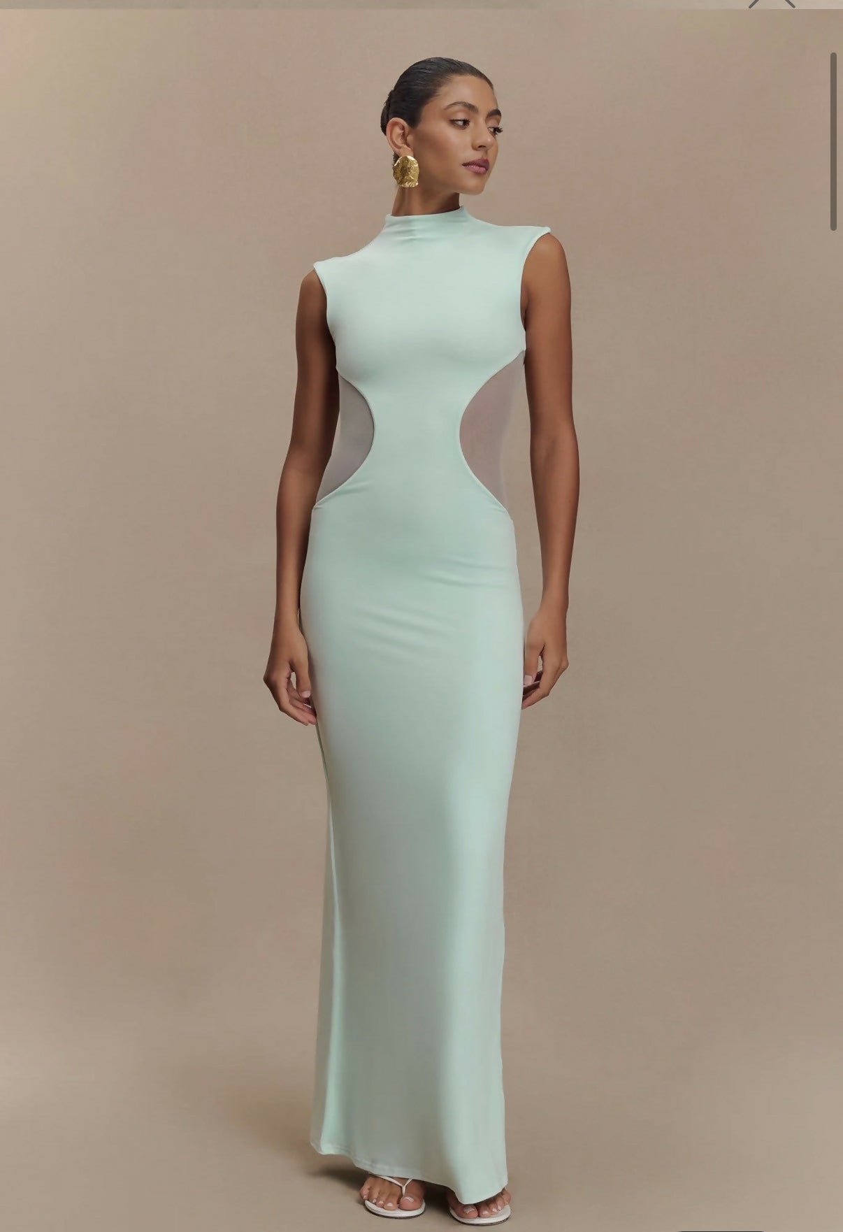 Mint green sleeveless maxi dress with mesh side cutouts and high neckline — Endless | Endless UAE