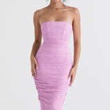 Model wearing Tana pink strapless corset midi dress with textured ruched fabric and figure-hugging silhouette — House of CB | Endless UAE