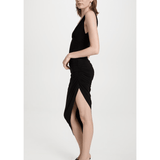 Woman wearing black sleeveless side draped gown with asymmetric hemline and ruched detailing — Norma Kamali | Endless UAE