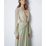 Woman wearing The Goddess Green Dress by Anne Louise Boutique — Endless UAE