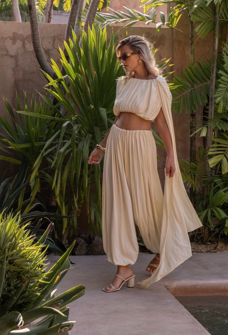 Cream cropped top and wide-leg pants co-ord set styled with sunglasses — Melissa Phair | Endless UAE