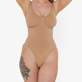 Beige thong bodysuit with adjustable straps and compression panels — Underhance | Endless UAE