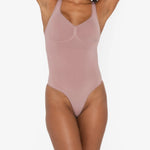 Beige thong bodysuit with adjustable straps and compression panels — Underhance | Endless UAE