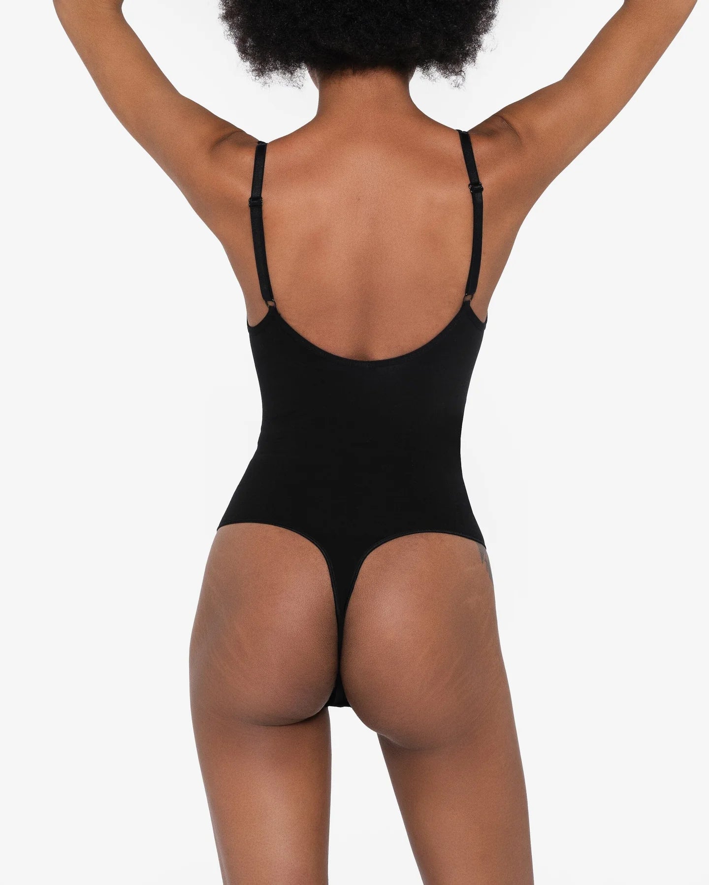 Beige thong bodysuit with adjustable straps and compression panels — Underhance | Endless UAE