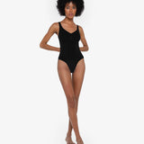 Beige thong bodysuit with adjustable straps and compression panels — Underhance | Endless UAE