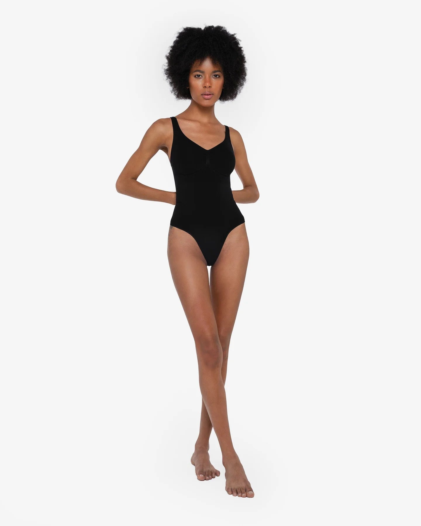 Beige thong bodysuit with adjustable straps and compression panels — Underhance | Endless UAE