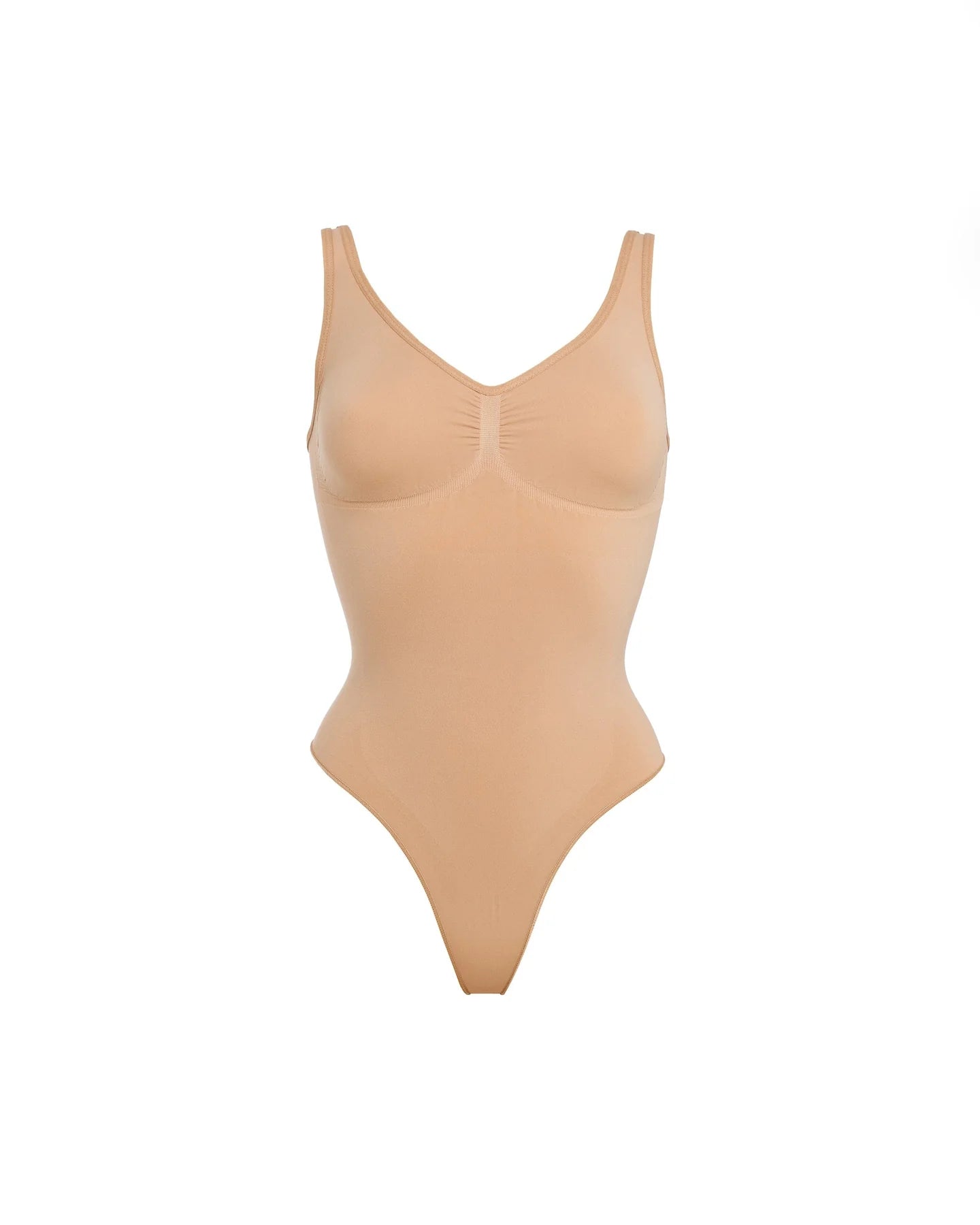 Beige thong bodysuit with adjustable straps and compression panels — Underhance | Endless UAE